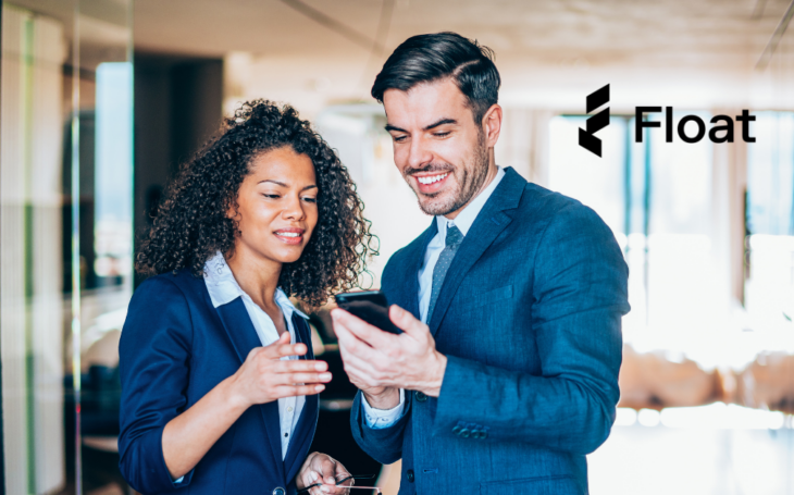 Two professional people looking at a phone