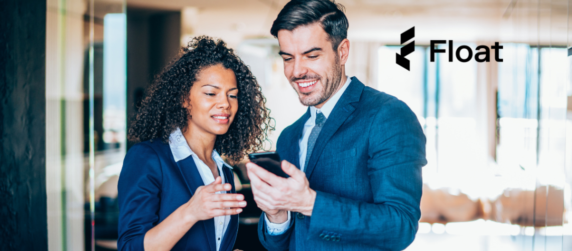 Two professional people looking at a phone